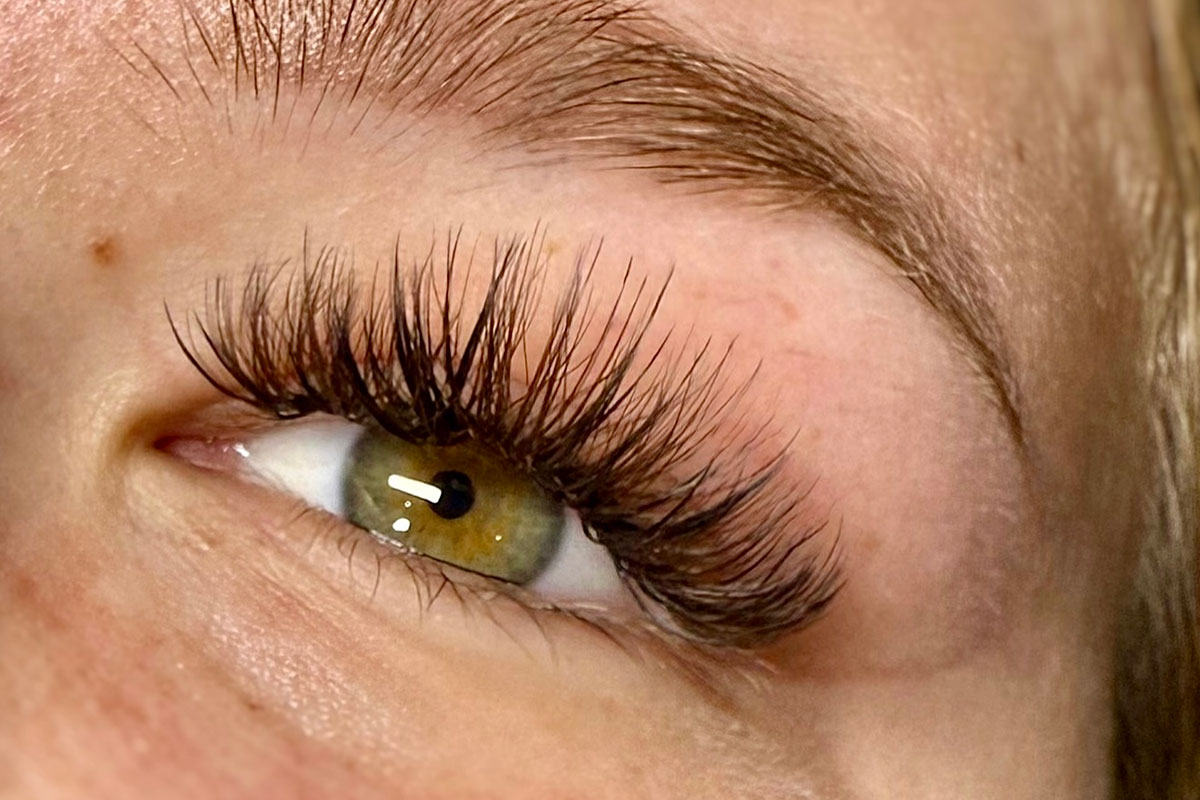 InBloomTattoo Laura Lashes closeup green eyes